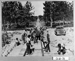 Photograph of men working on a railroad track, Moultrie, Colquitt County, Georgia, 1942