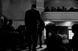 L. L. Anderson standing at the podium during a meeting at Tabernacle Baptist Church in Selma, Alabama.