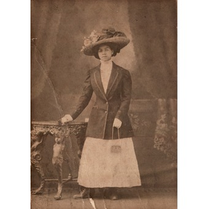 Thumbnail for An African American woman wearing an ornate hat