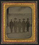 [Five enlistees from Co. K, 11th Ohio Infantry Regiment, one in uniform and three in hickory shirts, at Camp Dennison, three with bayoneted rifles]