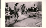 Photograph of Carver House Hotel and Casino diving board, featuring unidentified patrons