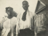 Ameal and Florence Wilson Standing Outside