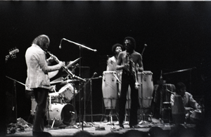 Miles Davis in performance: Dave Liebman (sax), James Mtume (congas), Miles Davis (trumpet), and Badal Roy (tabla)