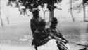 State Superintendent A. B. Hill and B. C. Caldwell and Alfred leaving Southland for Helena in the rain