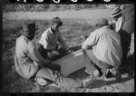 [Untitled photo, possibly related to: Negroes shooting craps behind tenant house, disposing of their cotton money on Saturday afternoon, Marcella Plantation, Mileston, Mississippi Delta, Mississippi]