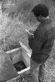 Thumbnail for Norman Lumpkin, news director for WRMA radio, making notes while examining an open grave at Lincoln Cemetery in Montgomery, Alabama.