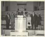 Eleanor Daley on a stage with others at a "We Care" event