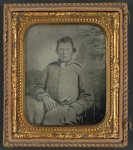 [Lewis Hicks of Company H, 53rd North Carolina Infantry Regiment with pistol in front of painted backdrop showing a gabled house]