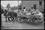 [Untitled photo, possibly related to: Negro farmer loading supplies into his wagon, Saturday afternoon, San Augustine, Texas]