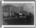 [Pedestrians on sidewalk along city street in Georgia]