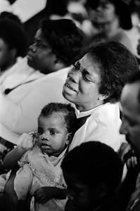 Emotional African-American mom at Easter church service in Roxbury, Boston