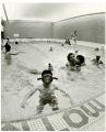 Family swim night at the Minneapolis YMCA North Community branch, Minneapolis, Minnesota, circa 1980.