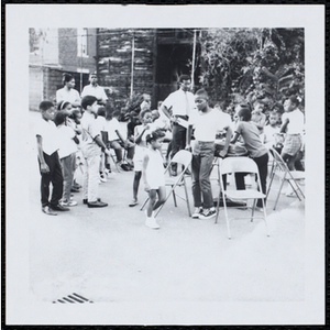 The participants playing musical chairs in the Little Sister Contest