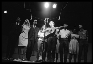 Bob Dylan leading performers on stage, Newport Folk Festival Left to right: Peter Yarrow, Mary Travers, Paul Stookey, Joan Baez, Bob Dylan, Bernice Reagon, Cordell Reagon, Charles Neblett, Rutha Harris, Pete Seeger