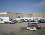 Trucks of the R. B. Burnham Van Service parked behind the company's building at 1584 Parallel Street in Montgomery, Alabama.