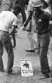 Two men standing beside the street near the end of the March Against Fear in Jackson, Mississippi.