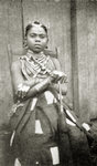 Kru woman with " shield " finger rings and hair ornaments