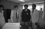 Thumbnail for Donald Bohana and David Cunningham, Jr. examine computer operations, Los Angeles, ca. 1978