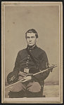 [Bugler Edmund F. Randall of Co. K, 1st Massachusetts Cavalry Regiment in uniform with sword]