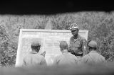 Officer instructing soldiers outside at the U.S. Army training facility at Fort McClellan near Anniston, Alabama.