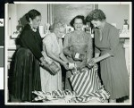 Thumbnail for Four women pictured holding canned vegetables, Los Angeles, ca. 1951-1960