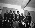 Walter Taylor (third from the left) standing with six men in masonic regalia