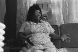 Fannie Bell Chapman: Centreville, Miss. Mrs. Chapman in house explaining healing with hands (FCP 15-72-7 #423)