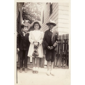 Three unidentified children pose in their Sunday best