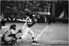 Hank Aaron mid-swing during his 715th home run, 1974