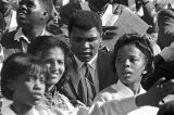 Muhammad Ali signing autographs during homecoming activities for Alabama State College on Thanksgiving Day in Montgomery, Alabama.