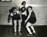 Ralph Metcalfe assists at Marquette basketball practice, 1932? - 1933?