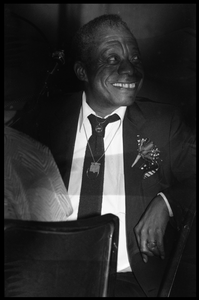 James Baldwin seated in the audience at his birthday celebration