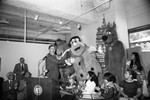 Children's Museum event guest Daryl Gates posing with Hanna-Barbera characters, Los Angeles, 1982