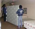 Employees moving a mattress at the La-Z-Boy Showcase Shoppe in Montgomery, Alabama.