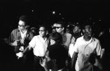 Rap Brown, Richard Boone, Stokely Carmichael, and others, standing on a street in downtown Montgomery, Alabama, during a civil rights demonstration.