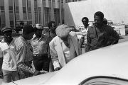 Tommy Lee Hines with his father and other men outside the Cullman County courthouse before his trial in Cullman, Alabama.