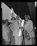 James Francis Marion Jones, (aka Prophet Divine) of Detroit with supporters at Los Angeles Union Station, Calif., 1952