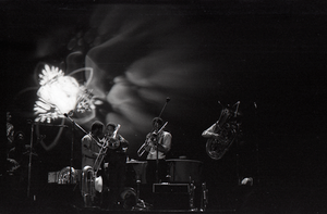 Taj Mahal in concert at Northfield, Mass.: horn section playing in front light show