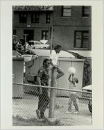 Officer J. L. Smith, With Special Operations, Standing in Herndon Homes