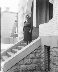 Mary McLeod Bethune standing on steps, front entrance to house : film photonegative