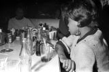 Barbara Howard Flowers and others, seated at a table at a club, probably in Montgomery, Alabama.