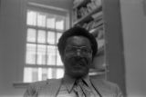 John Blassingame: New York. John Blassingame seated in office, Fredrick Douglas portrait on the wall (BLJP 1-79 #101)