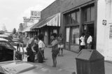 James "Son" Thomas and Joe Cooper, Leland, Mississippi. Street scene, cafe. (JTP 6-76-3)