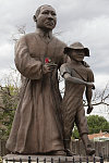 Photo of the statue of the civil-rights pioneer at the Dr. Martin Luther King Jr. Cultural Center and Museum in Pueblo, Colorado, taken in September 2015, one year before the museum was closed and its artifacts placed in storage. King stands besides a young Emmett Till, a young Mississippi man whose murder by whites in 1955 helped spur the civil-rights movement