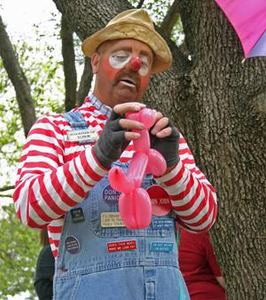 Clown making balloon dog