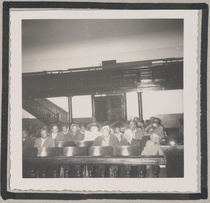 Photograph of African American men and women sitting in an auditorium, Clarkesville, Habersham County, Georgia, 1950