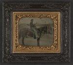 [Unidentified soldier in Union uniform sitting on horse with revolver and saber]