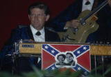 Man playing a steel guitar during a gubernatorial campaign rally for Lurleen Wallace at the Municipal Auditorium in Birmingham, Alabama.