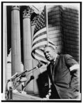 [James Farmer, half-length portrait, behind microphones at Foley Square in New York, speaking at memorial for four African American girls killed in church bombing in Birmingham, Ala.]