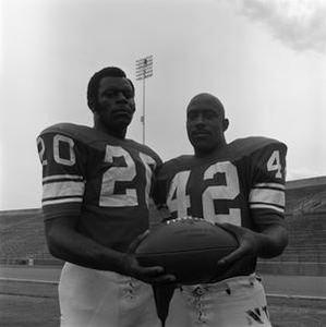 Two football players holding a ball, 3